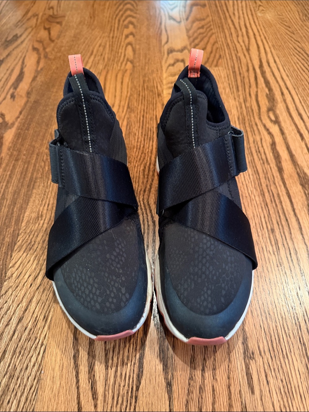 Sorel Women’s Black Slip-On Sneakers with Coral Pull Tabs